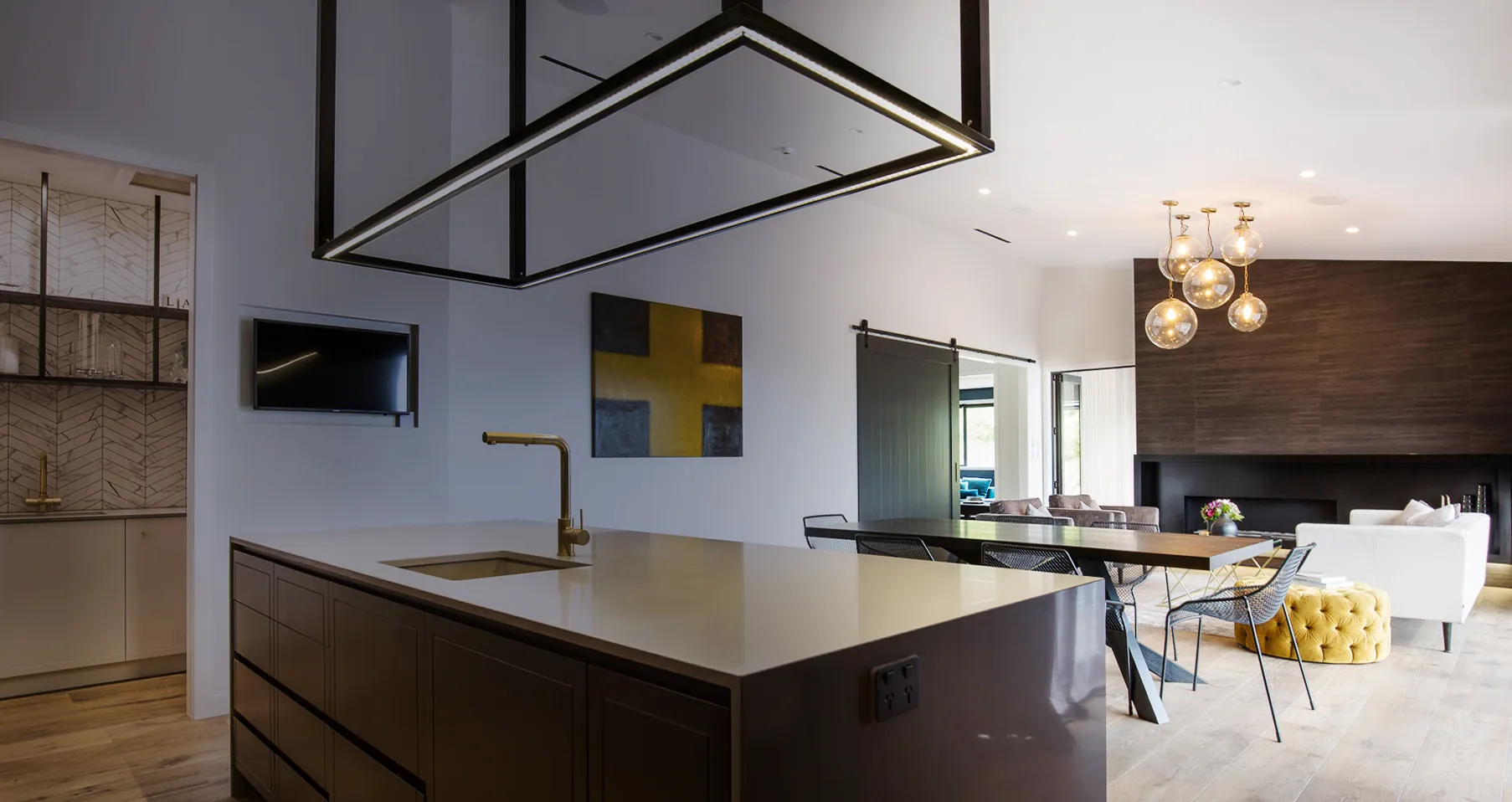 Modern Auckland kitchen and living area with electrical fitout by Totally Amped Electrical